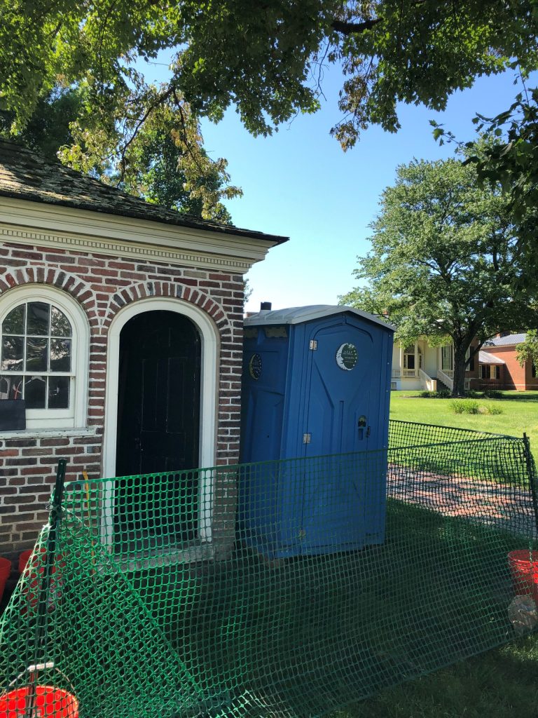 Porta-potty next to Homewood privy.