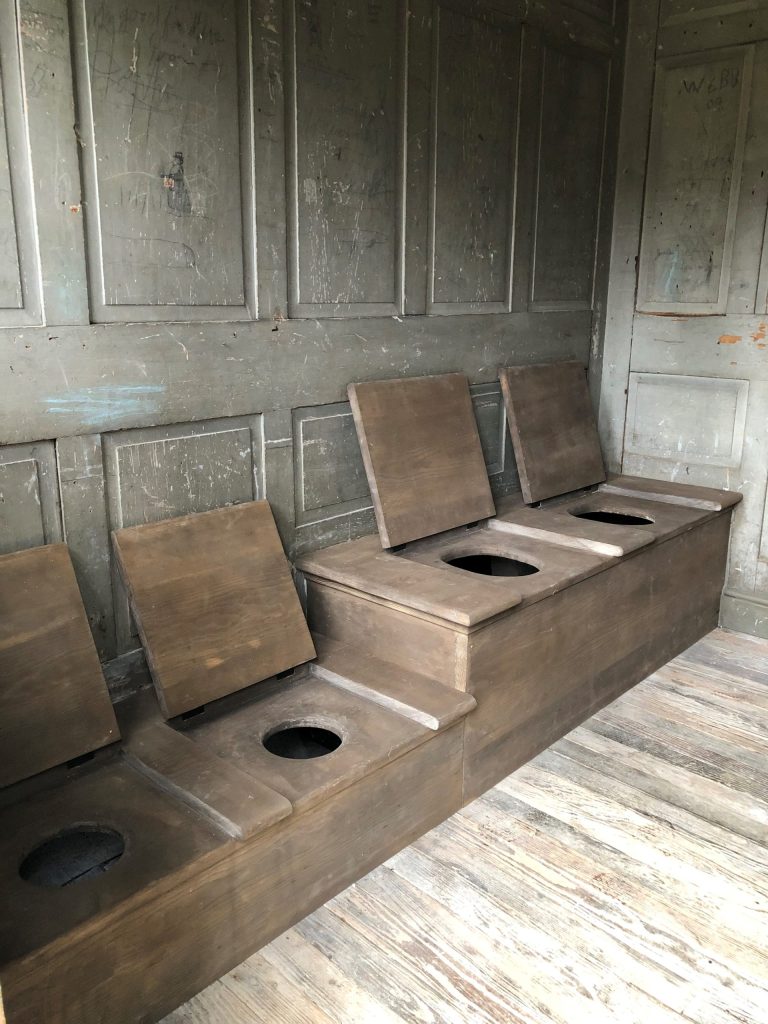 Privy seats after restoration.